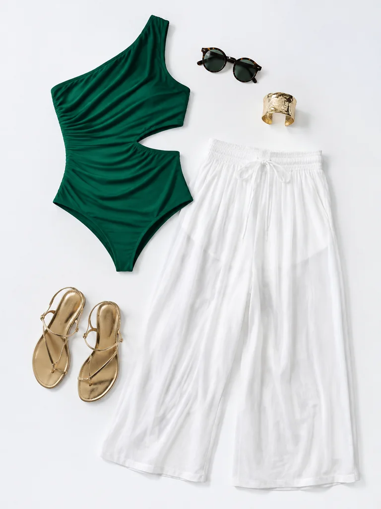 Coffee in the city outfit reference: green one-shoulder cutout top, white wide-leg trousers, and gold sandals