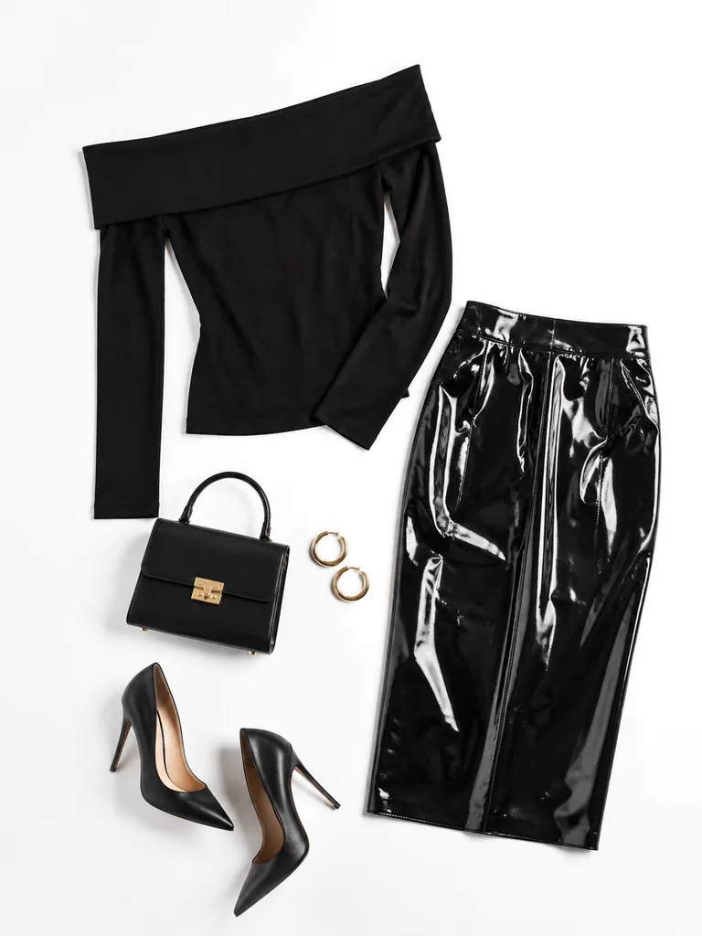 After-dark gloss outfit reference: black off-shoulder top, glossy midi skirt, pointed heels, handbag, and hoop earrings
